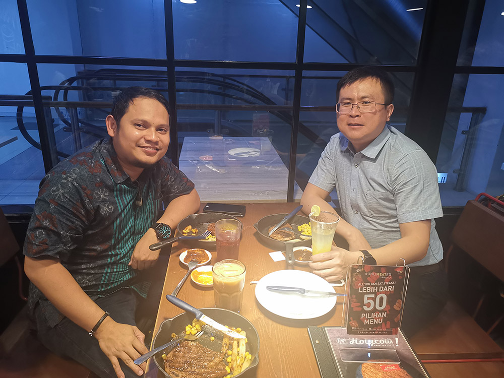 Eric goes abroad to visit clients