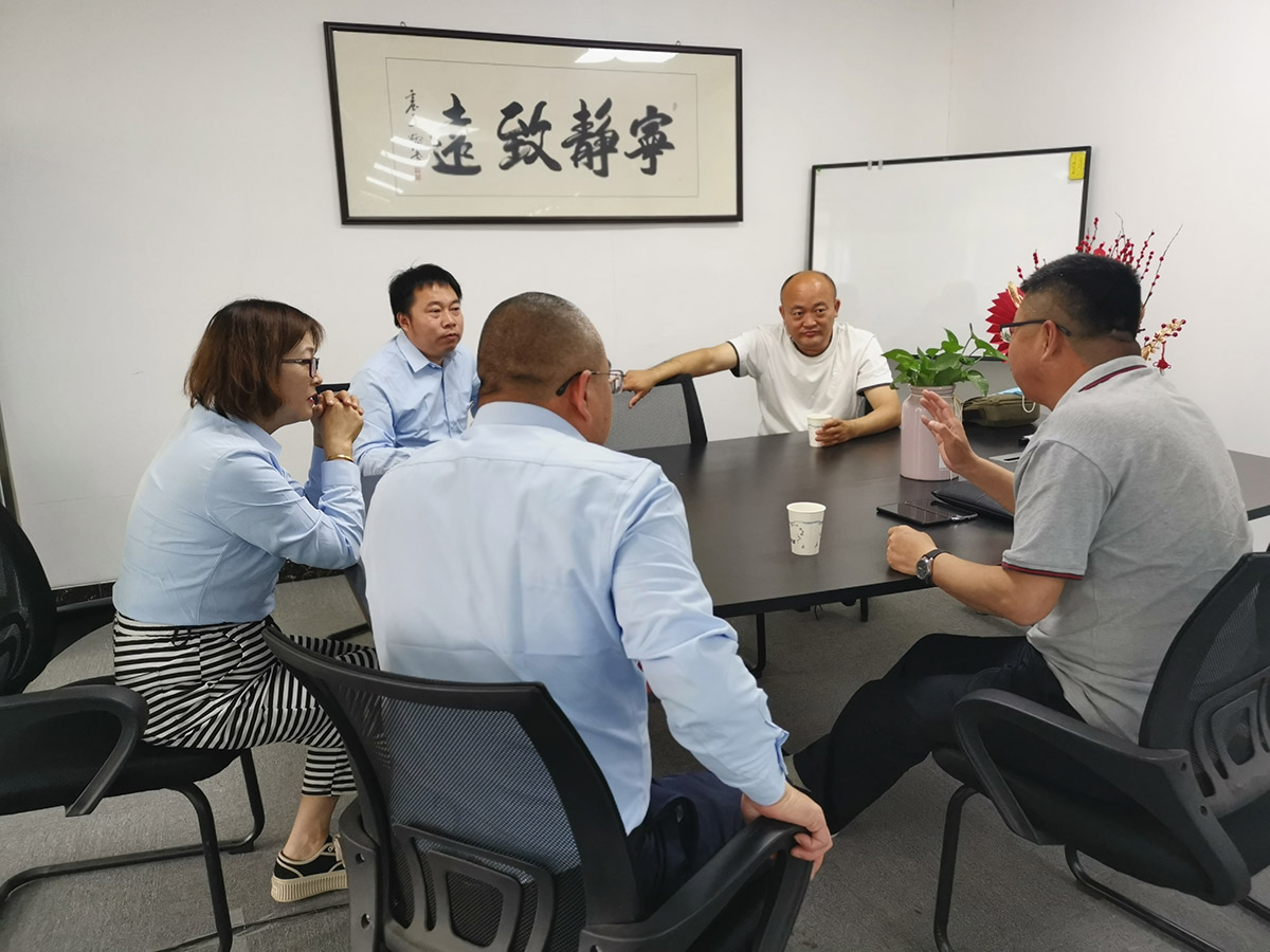 Several colleagues discuss a custom product