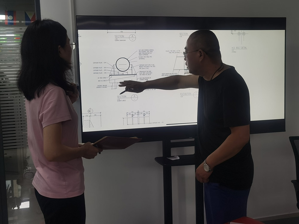 Haphry and the product manager discuss the technical details of customer requirements